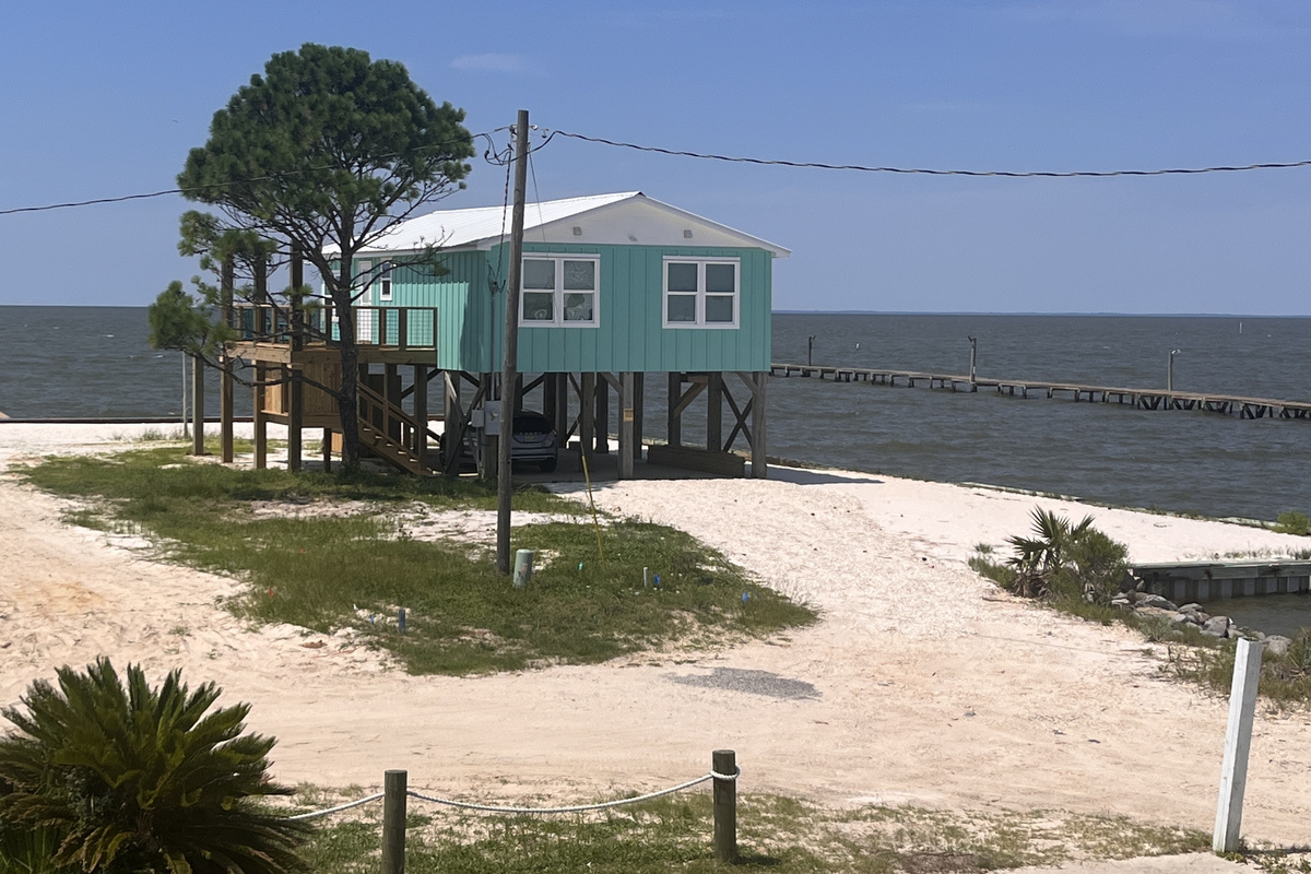 Welcome to Serenity Now! Experience the ultimate coastal retreat at this beautifully maintained home