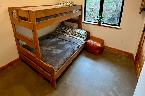 Guest bedroom with twin over full bunkbed and room darkening shades