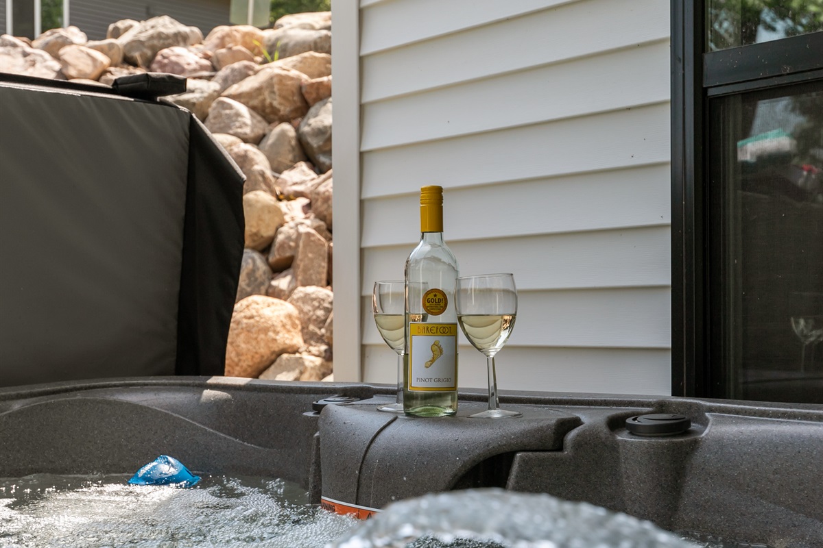 Relax and unwind in the private hot tub—perfect for soothing soaks after a day on the lake.