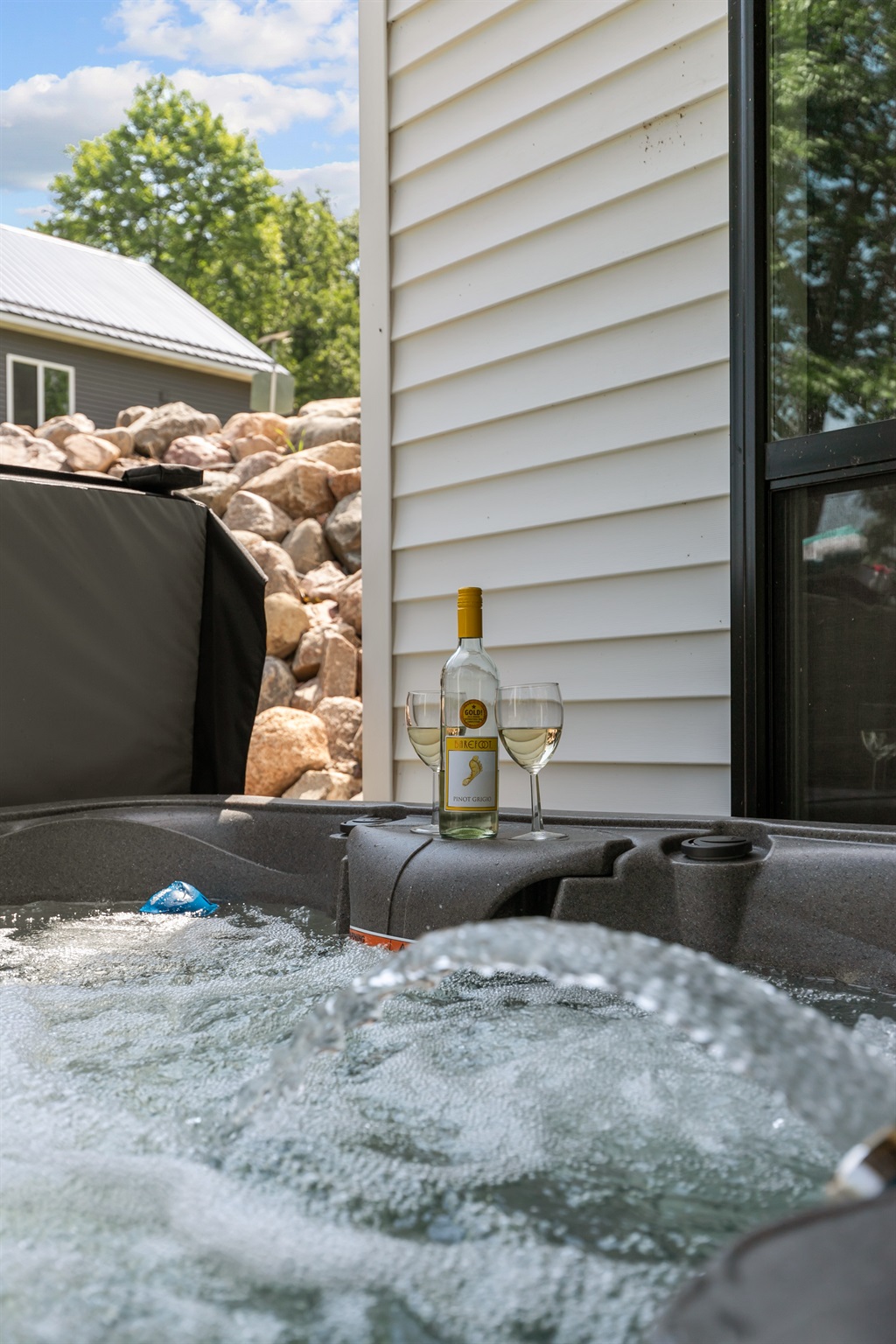 Relax and unwind in the private hot tub—perfect for soothing soaks after a day on the lake.