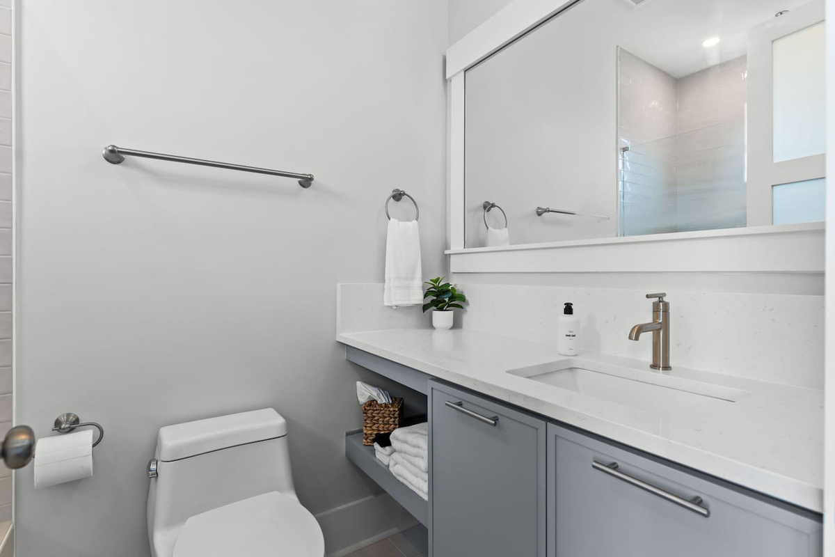 Thoughtful touches make every stay easier. This private en-suite bathroom comes stocked with essentials like hand soap, makeup cloths, tissues, and more.
