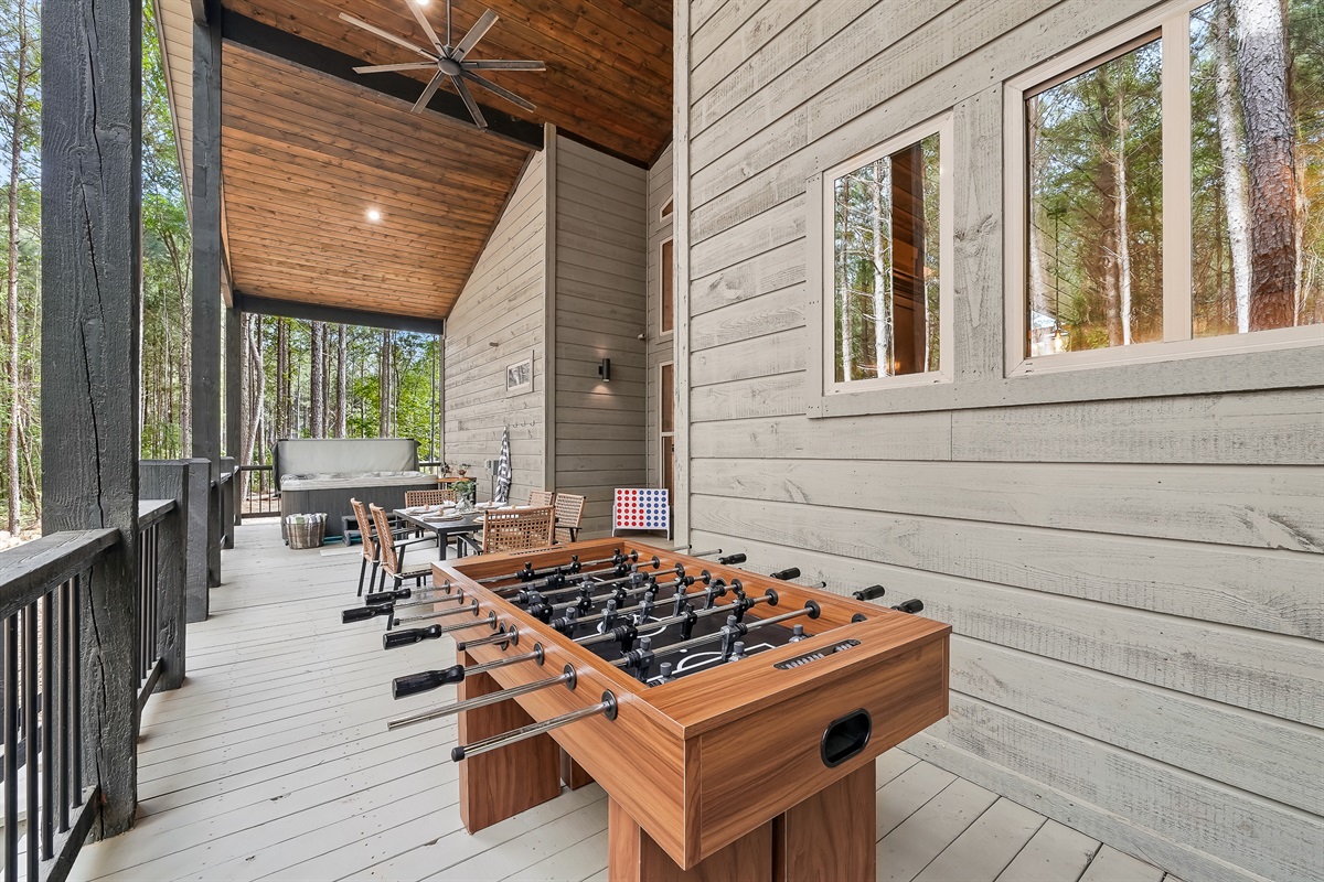 Foosball outdoors just hits differently! You can also enjoy Connect 4 for some extra fun.