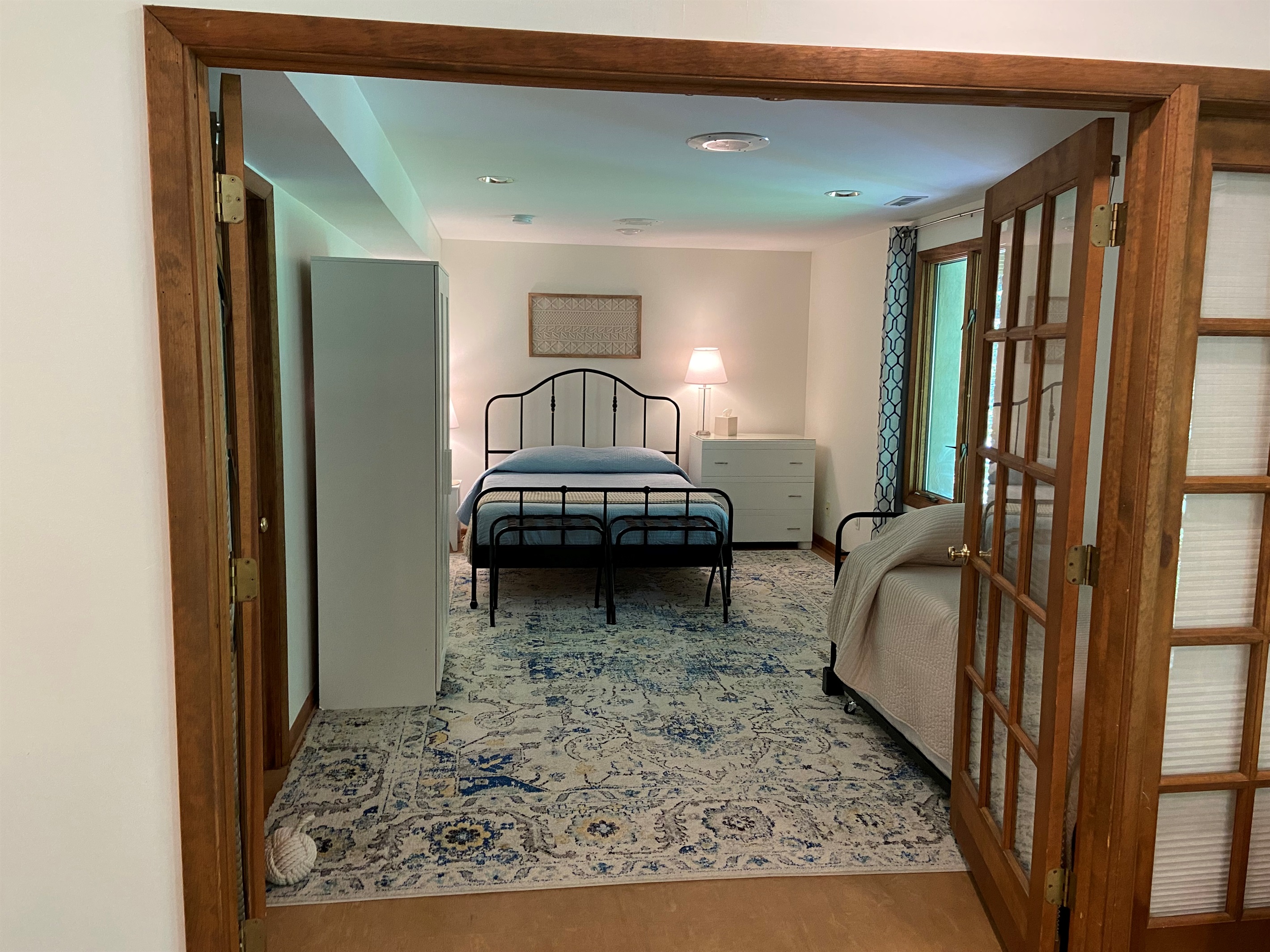 Spacious bedroom sleeps four. If fewer than four guests, the extra trundle mattress remains below the twin bed (unless otherwise requested)..