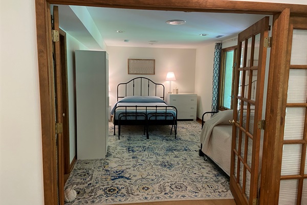 Spacious bedroom sleeps four. If fewer than four guests, the extra trundle mattress remains below the twin bed (unless otherwise requested)..