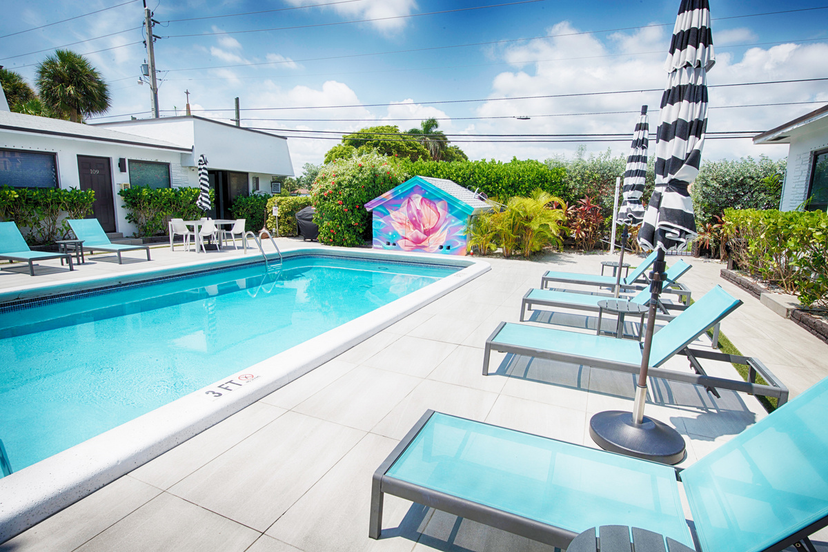 Resort-style pool with vibrant mural