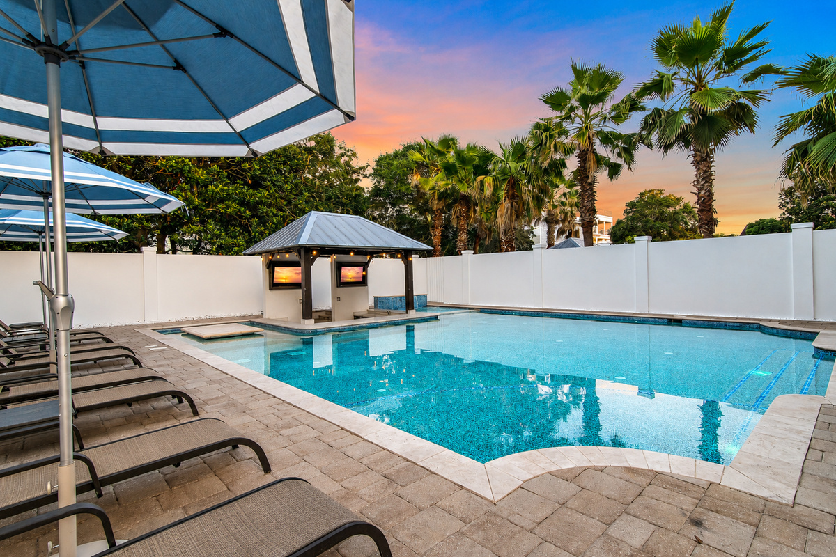 Unwind poolside as the evening lights come alive