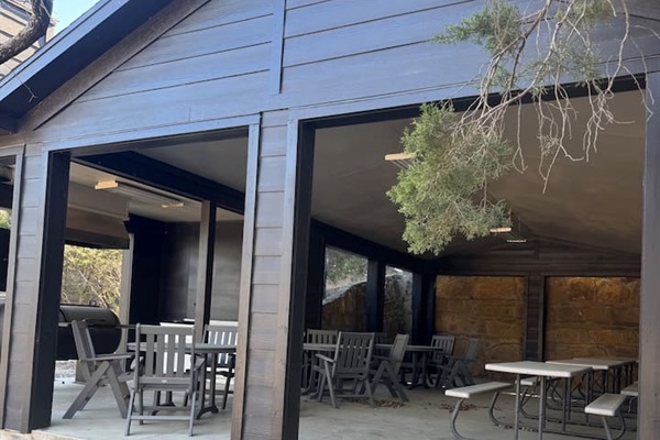 Common area with large grill and picnic tables