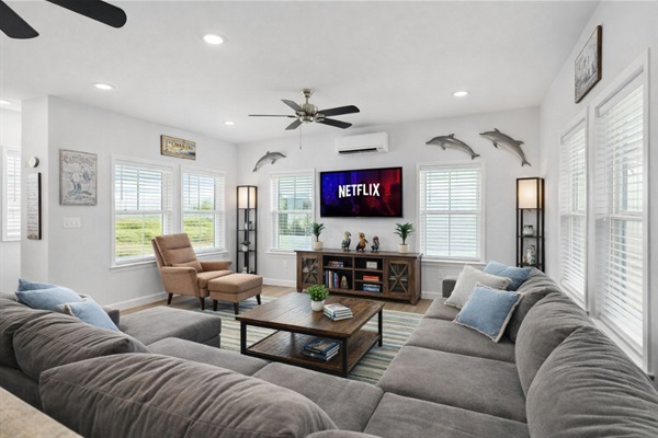 Living Room + Shuffleboard (Main Floor): Hidden shuffleboard table behind the couch adds a fun surprise for friendly competition.