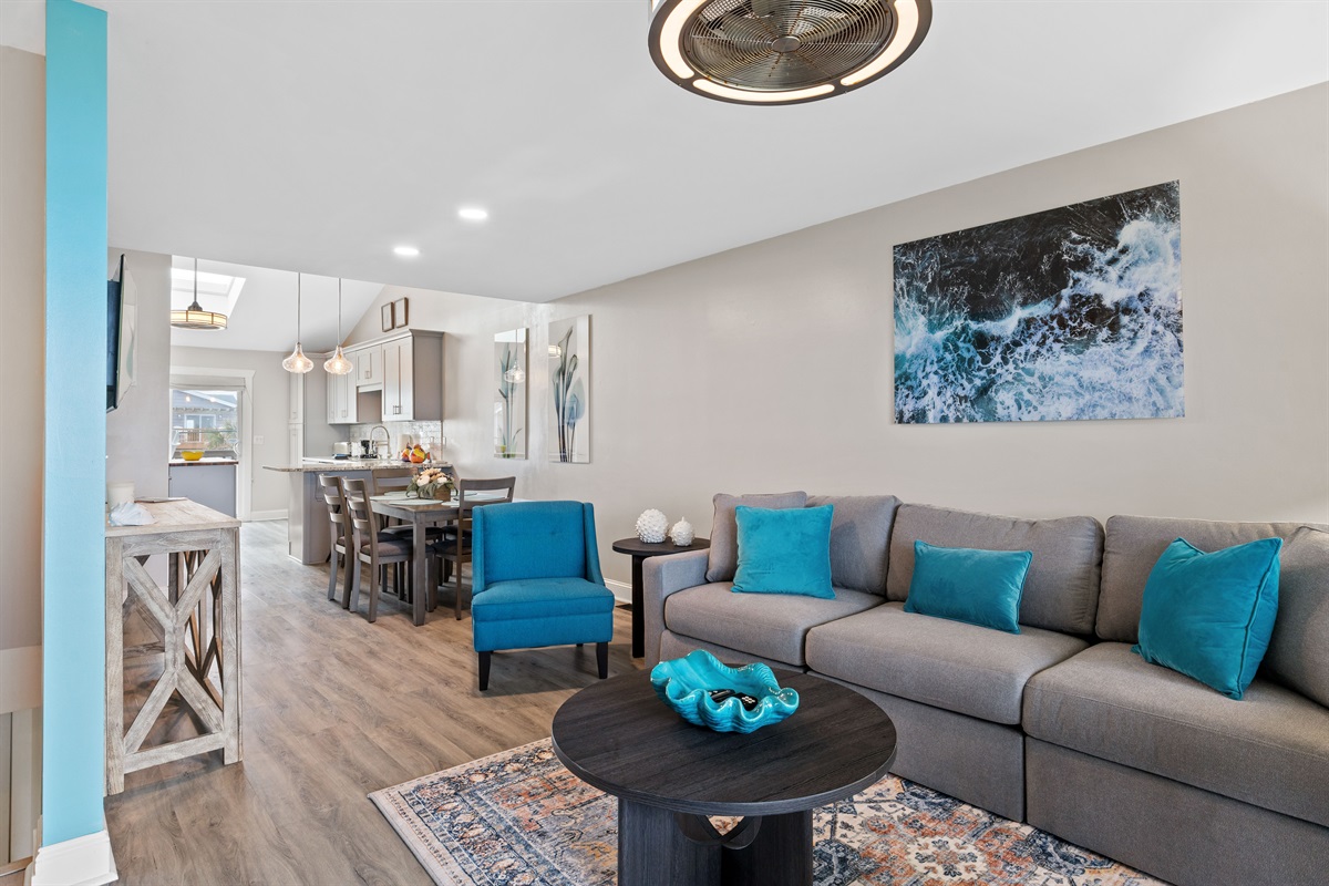 Open layout that flows from living to dining to a fully stocked kitchen made for easy stays