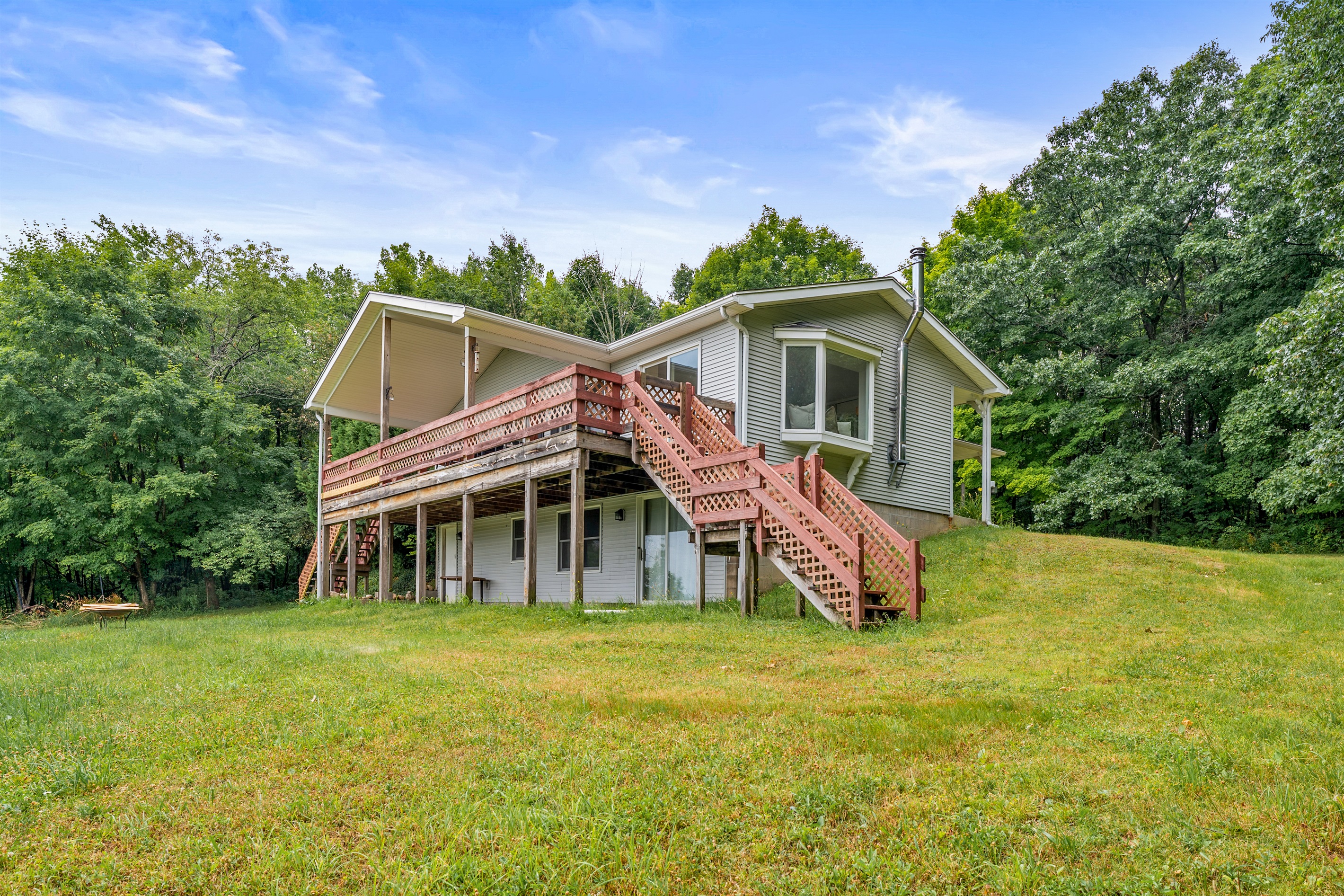 Spacious walkout lower level and elevated wraparound deck offer endless outdoor possibilities