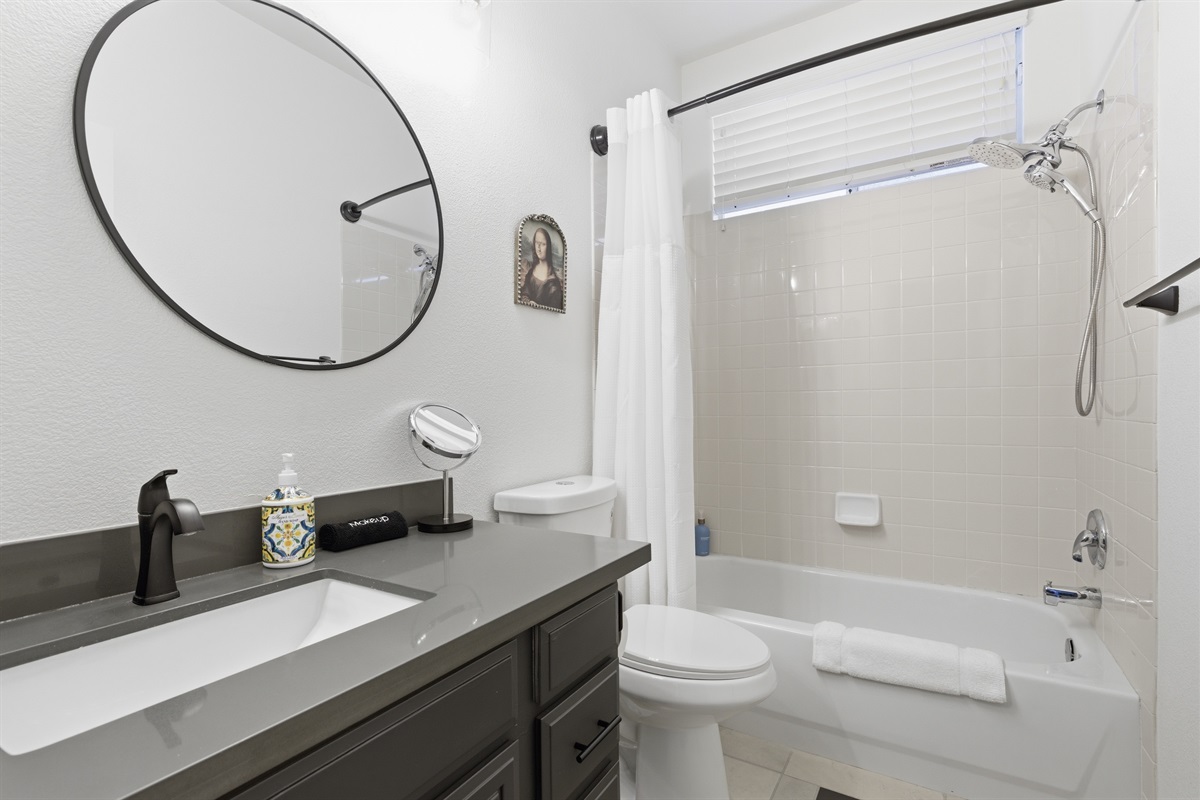 Downstairs hallway bathroom with and a bathtub/shower combo.  The majority of our bathrooms have a double sink.  It's Showtime!