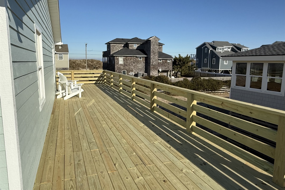 New deck with safety gates at the top of both sets of stairs so your dogs or kids stay safe. 