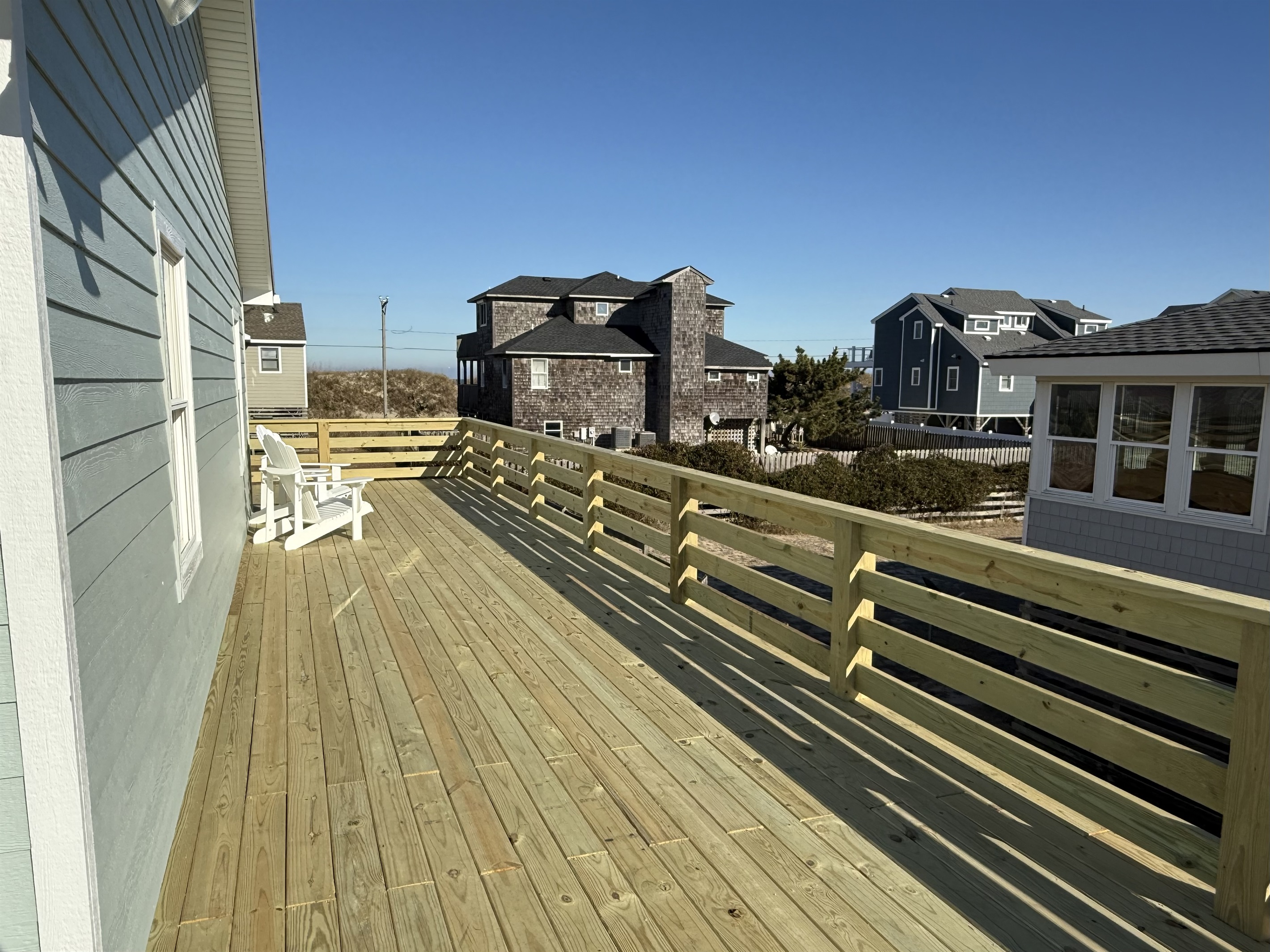 New deck with safety gates at the top of both sets of stairs so your dogs or kids stay safe. 