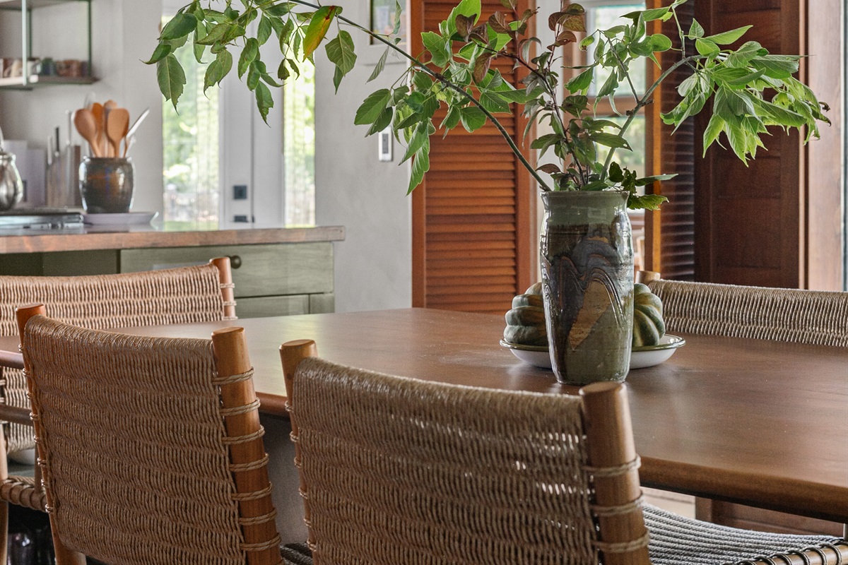 The dining room is designed for gathering — whether it’s a family dinner, a holiday meal, or a game night that stretches late into the evening. A table for six sits at the center, offering plenty of space to share good food and conversation.