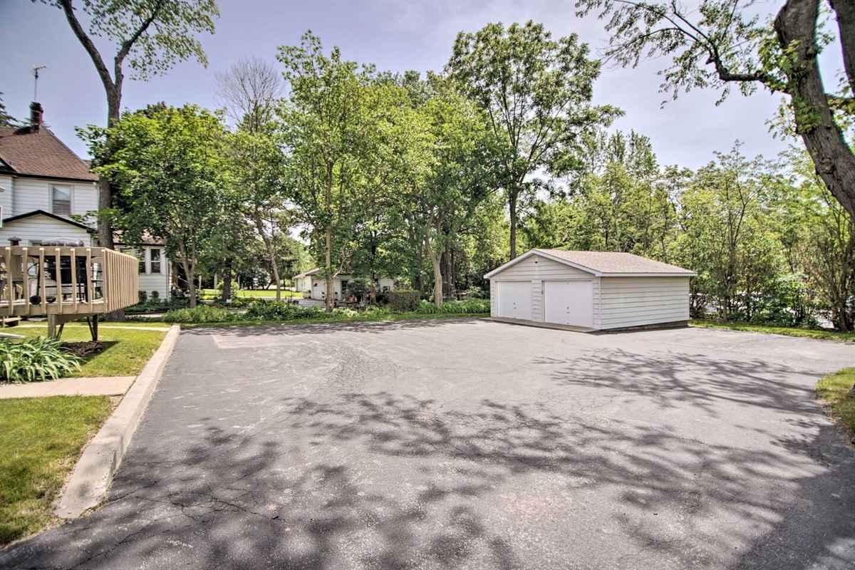 Ample parking for up to two cars is shown. One side of the detached garage is available for your parking convenience. 