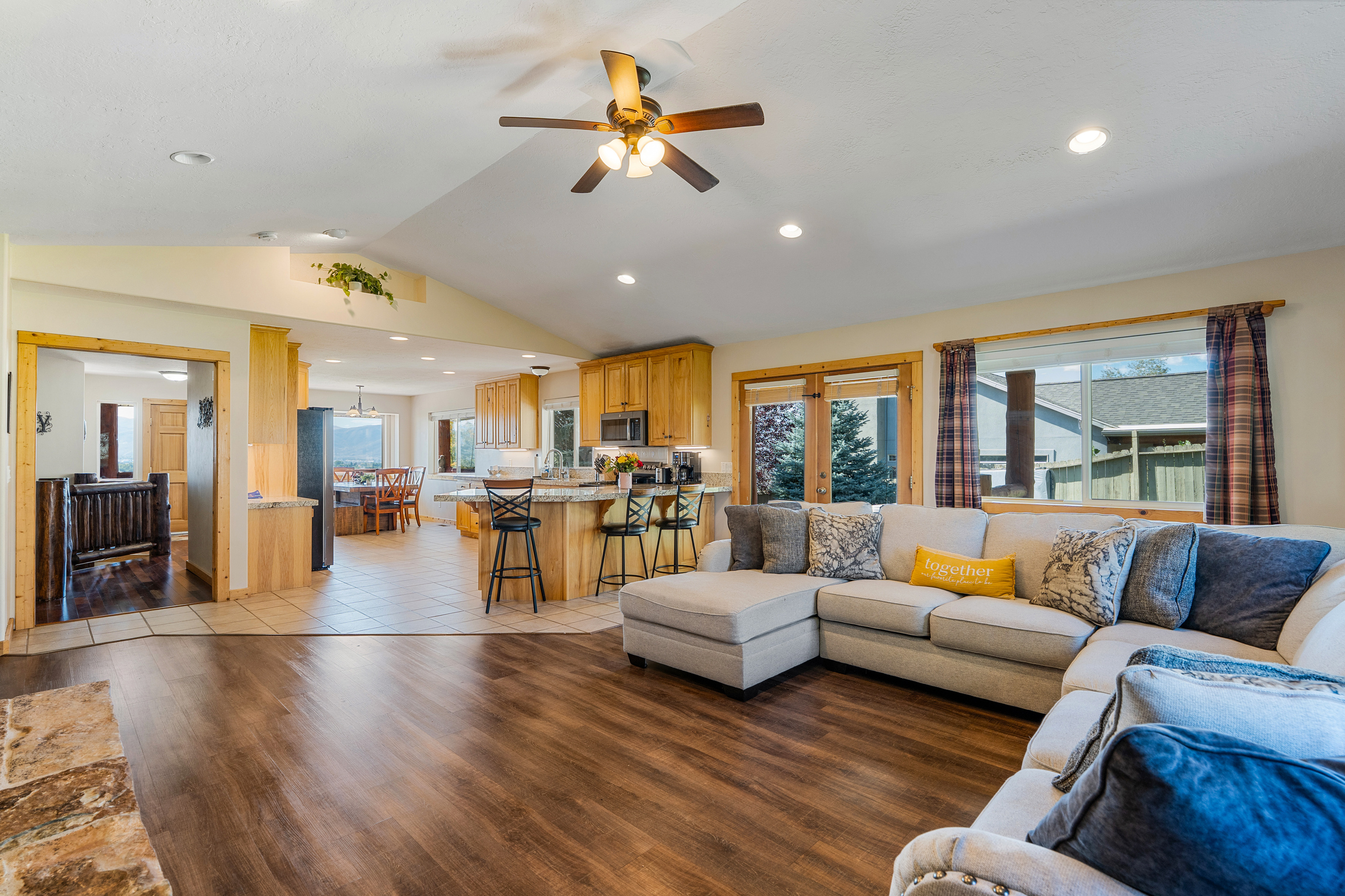 The large expansive living area connects the entire home with the views outside from the fireplace to the kitchen. A true gathering place for family and friends!
