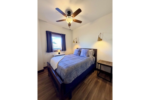 Master bedroom with queen size bed.