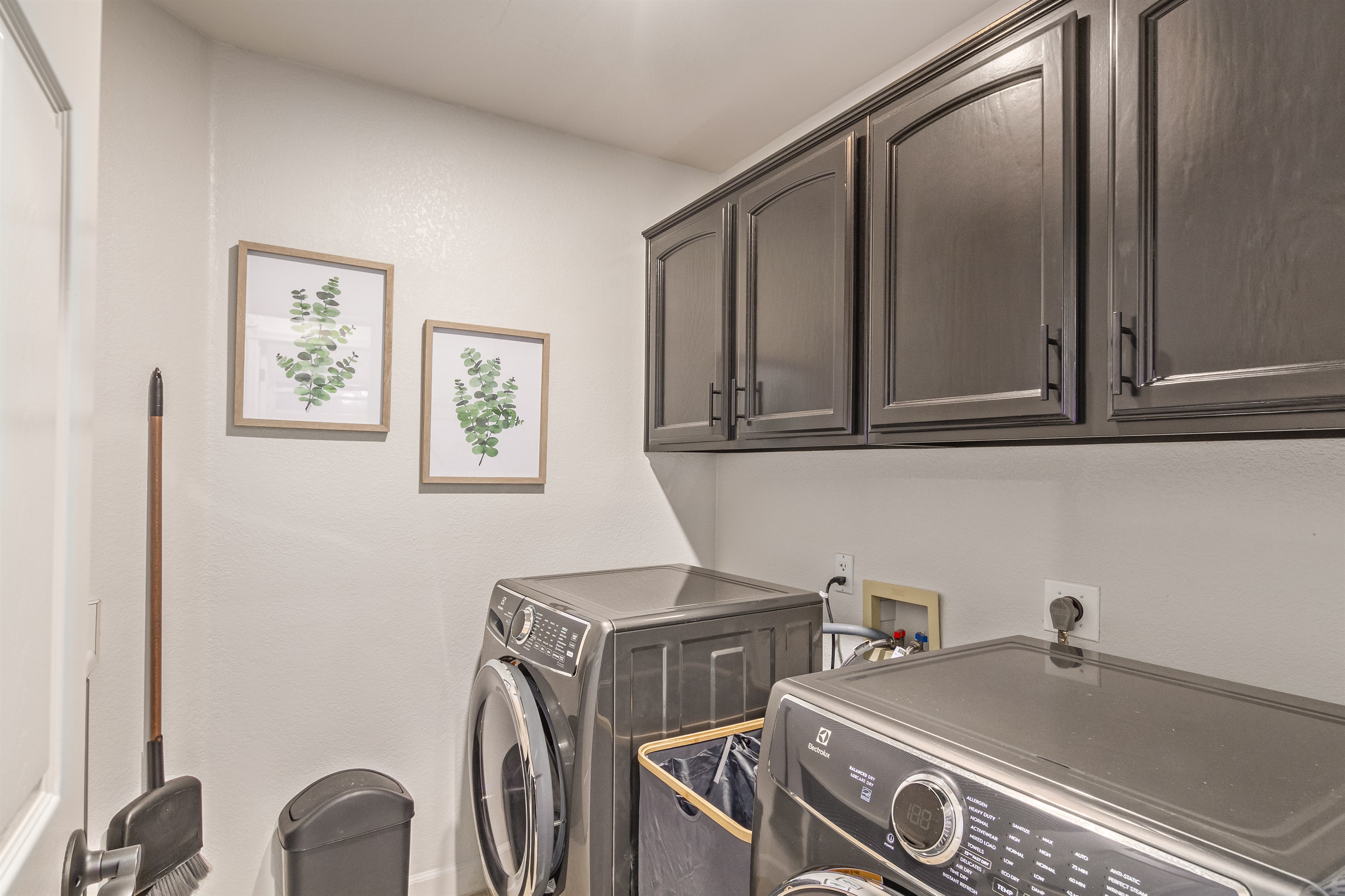 Main floor laundry room with washer and dryer