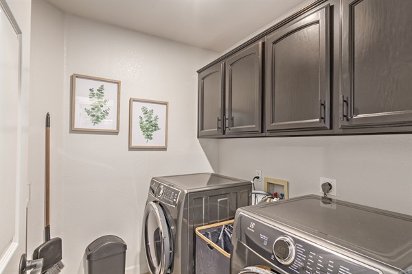 Main floor laundry room with washer and dryer
