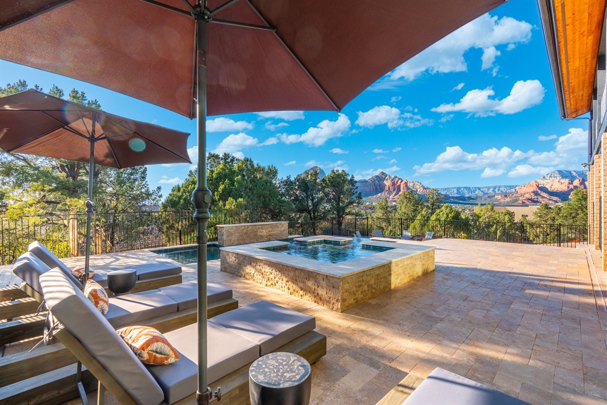 Resort-style backyard with pool, spa, and stunning red rock views—pure Sedona luxury.