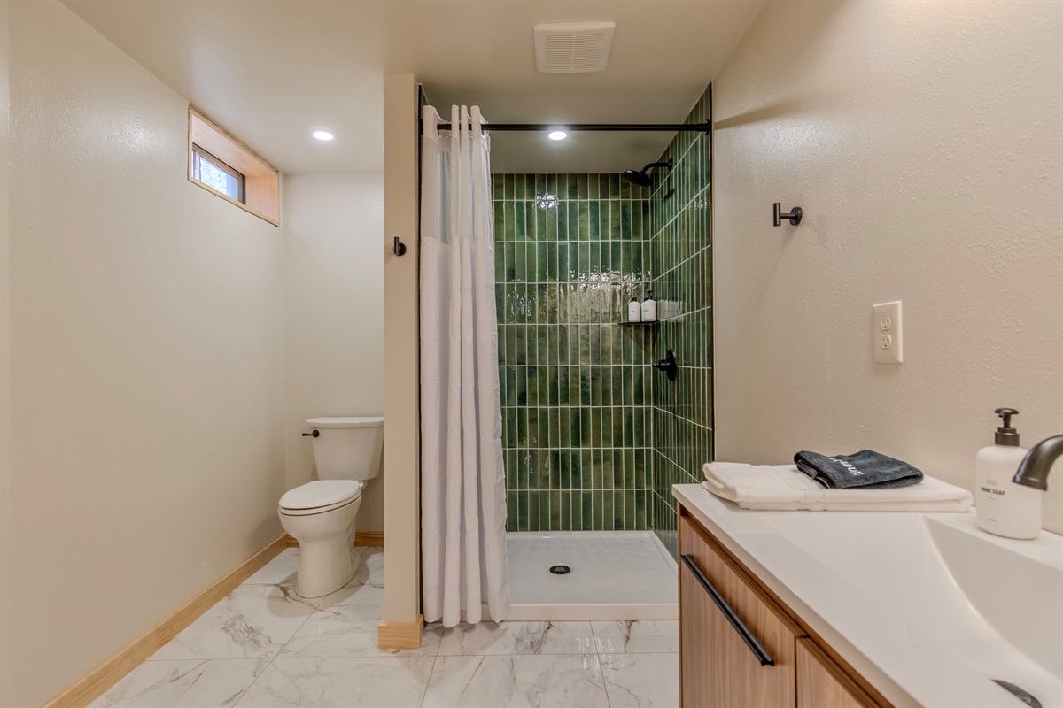 Basement level bathroom.  Shampoo, conditioner and body wash are provided during your stay.