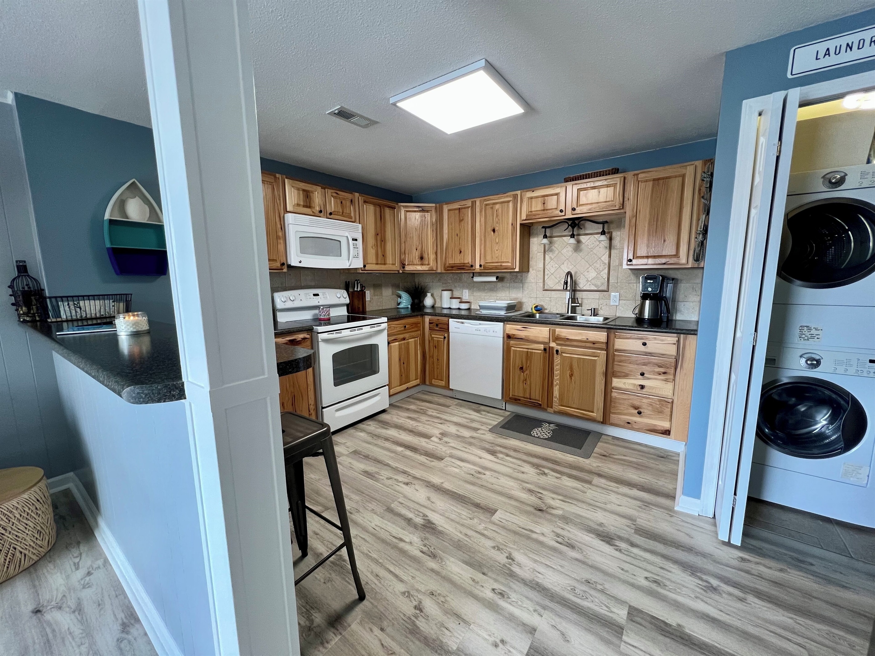Fully stocked kitchen with additional bar top dining