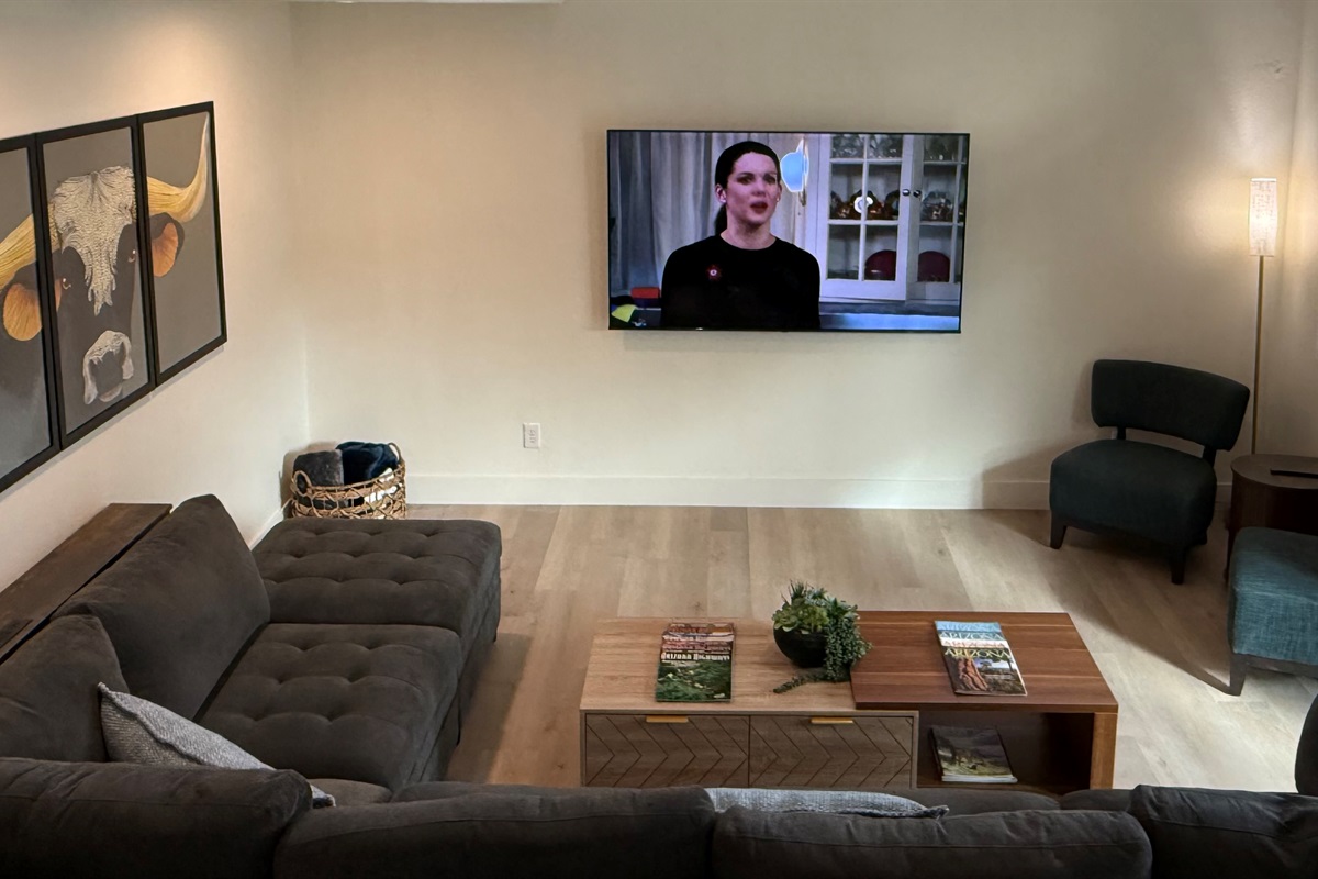 Large living room with access to patio & backyard