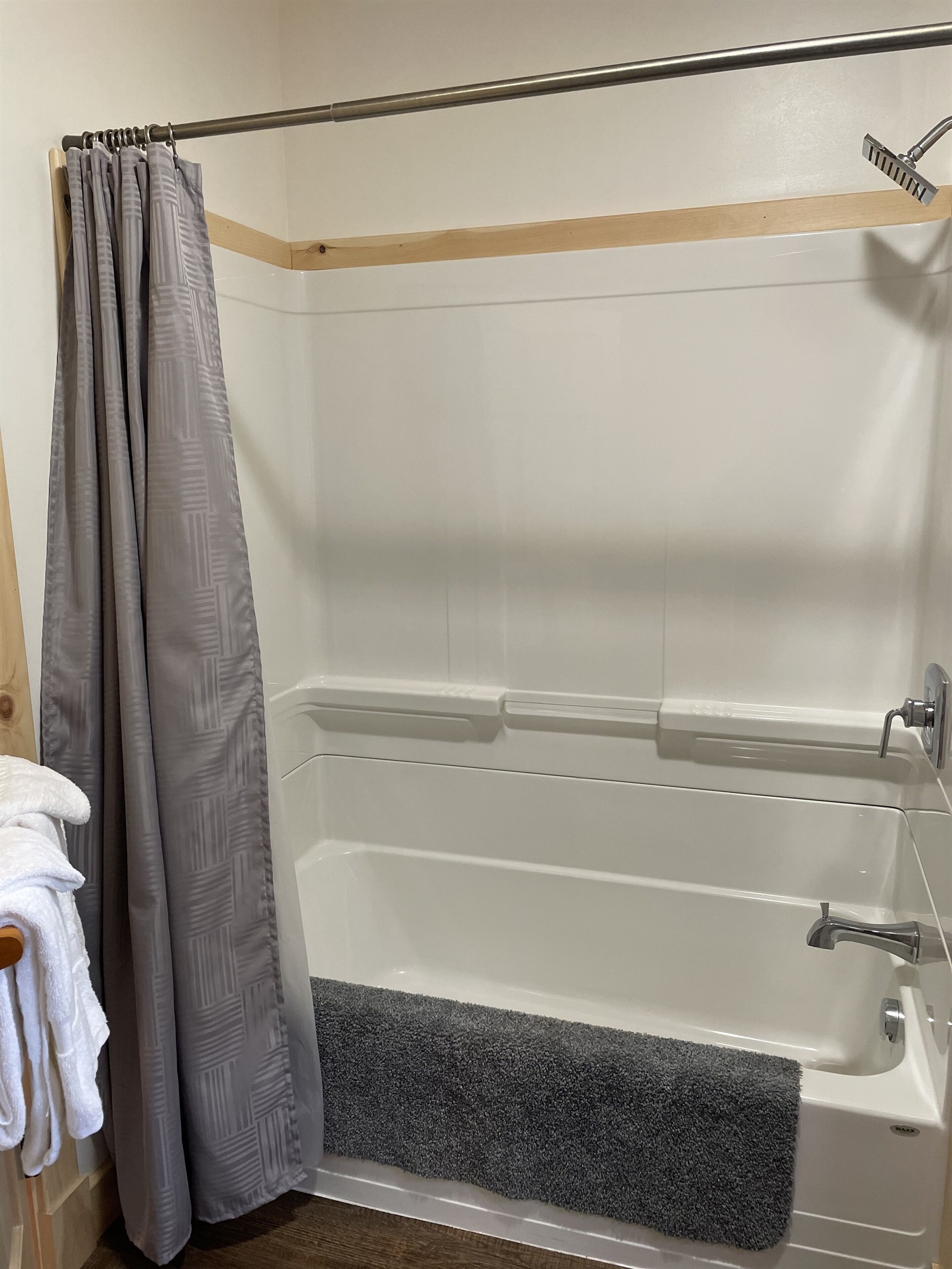 Full bathroom with washer and dryer