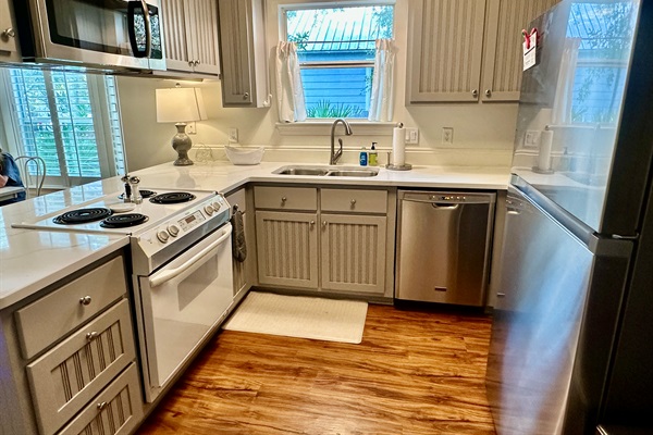 Stocked kitchen with air fryer, keurig, and coffee maker