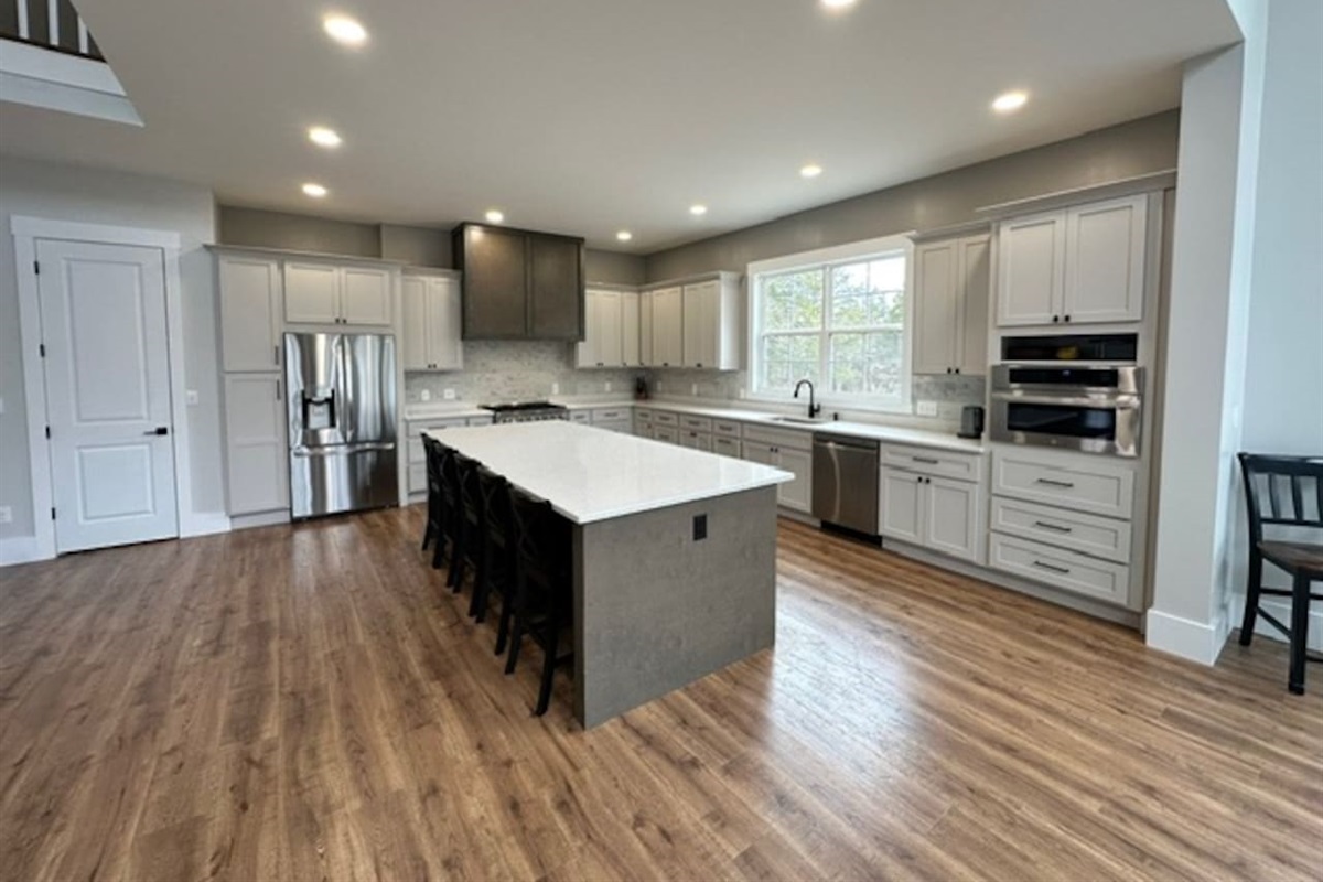 Island seats 5 with an additional two stools in the dining area. Kitchen table upgrade coming soon to accommodate even more guests. Plenty of pantry space, kitchen appliances, dishes, mugs, etc.