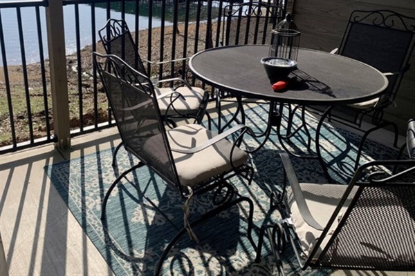 Patio table and chairs with a lakeside view!