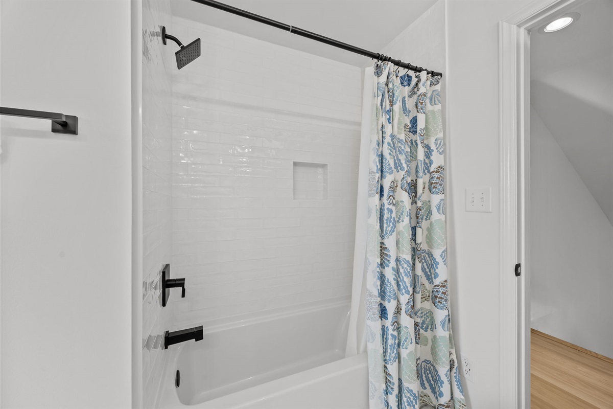 Full bathroom with tub and shower combination on the second floor