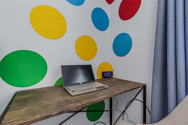 Work is easy from the Twister Room- you can even use the TV as a monitor.