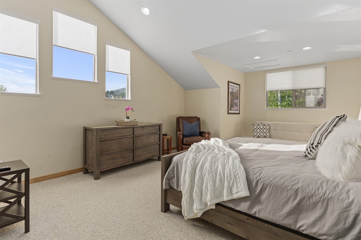 Bright and airy bedroom with plenty of space to relax and recharge.