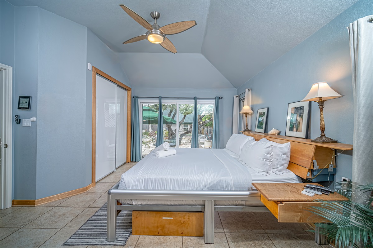 Master suite w custom king, dual zone, adjustable number bed w 2 remotes. View & access both pool & patio thru oversized, climate controlling sliding glass doors. Black-out drapes. Accent lighting, GFiber TV, ceiling fan in vaulted ceiling.