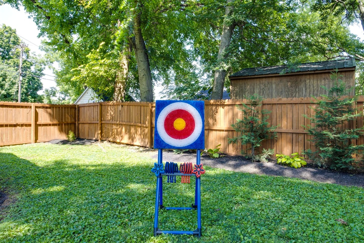 Time to play! Enjoy a friendly game of axe throwing in the backyard.
