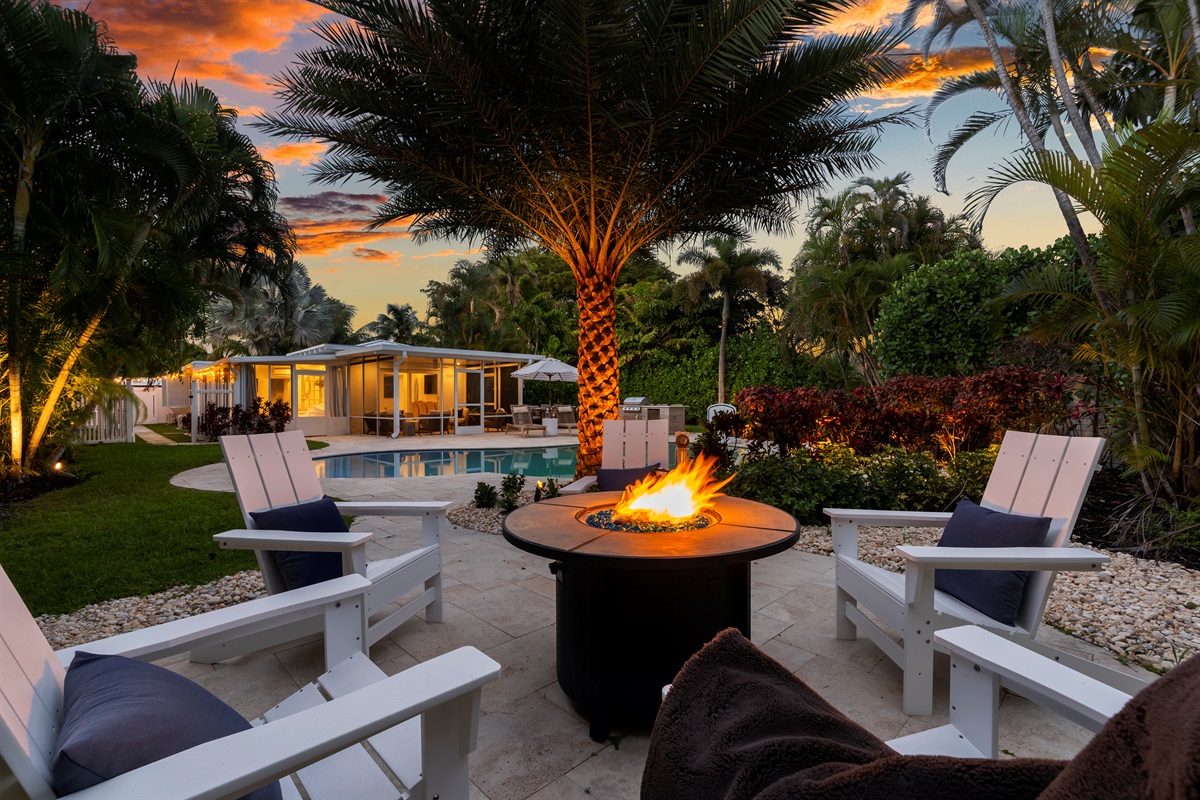 Unwind by the fire! End your perfect day gathered around the fire pit, set beneath the palms, overlooking the beautifully lit pool and house. Pure vacation bliss!