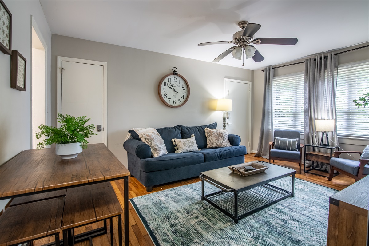 Stylish and sunlit lounge space featuring neutral tones and thoughtful decor for a welcoming vibe.