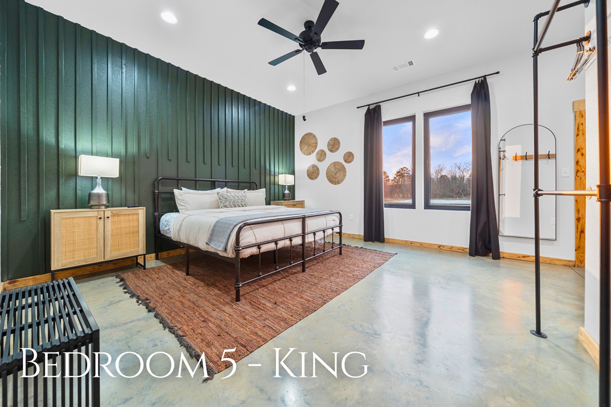 Bedroom 5 provides a generous king bed and plenty of natural light, making mornings feel bright and refreshing.