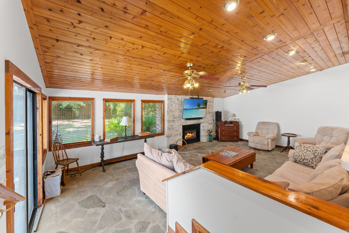 Family room with large TV and outside access