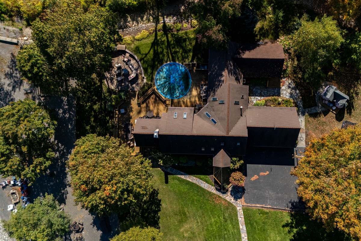 Tree-lined lakehouse offering privacy, a roomy deck, and easy access to outdoor fun. A serene getaway tucked into the woods.