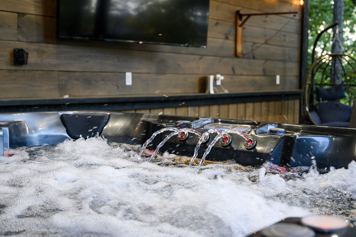 Unwind in the hot tub after a day in Broken Bow, surrounded by trees, fresh air, and total relaxation.