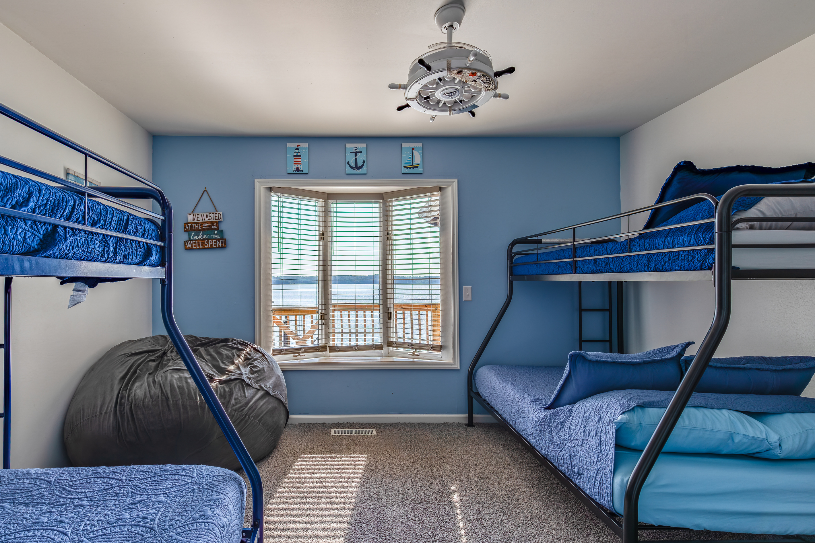 The upstairs bunkroom features two twin-over-full bunks, providing flexible sleeping space for up to six guests.