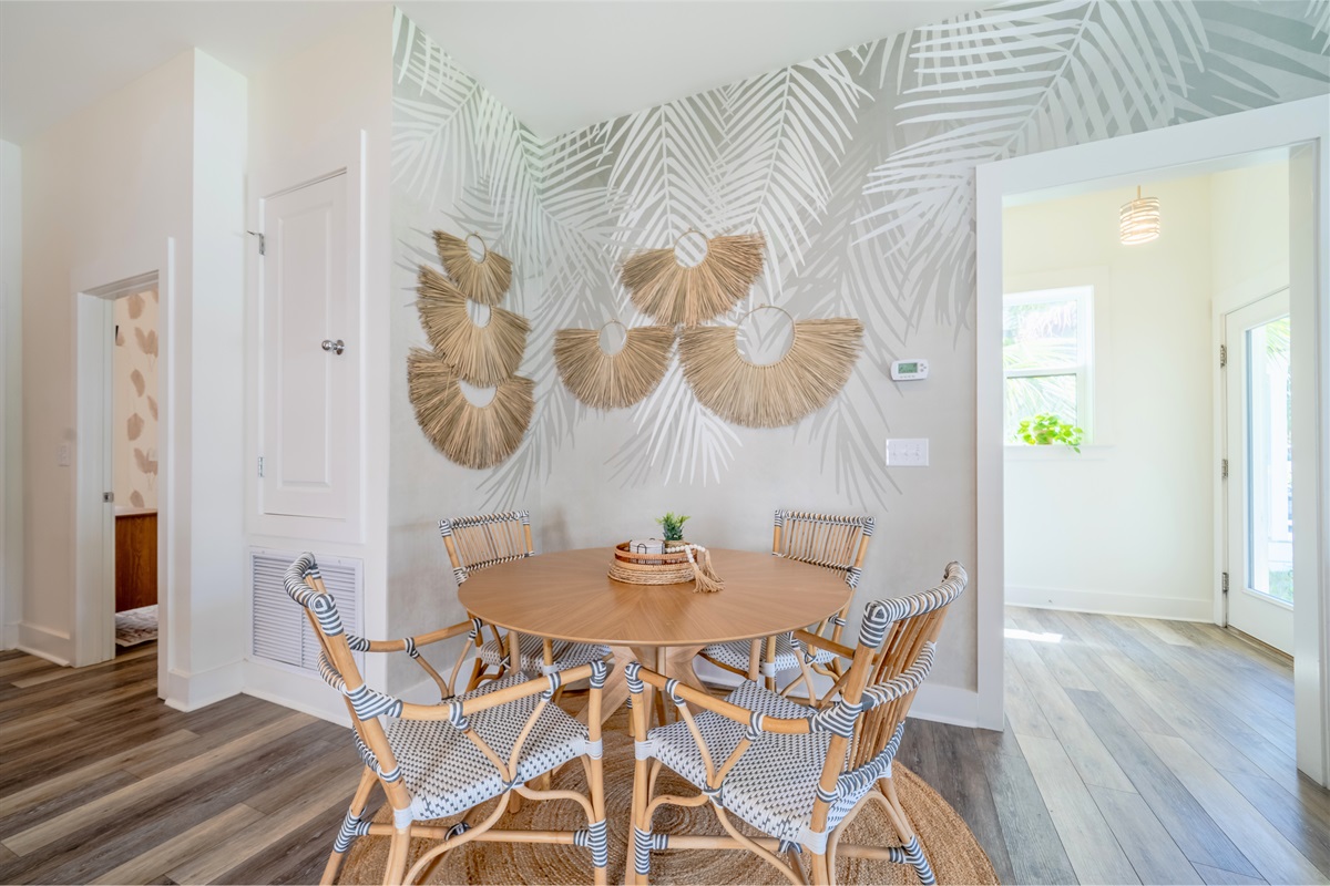 Dining table with a tropical touch—enjoy meals by the stylish palm tree accent wall