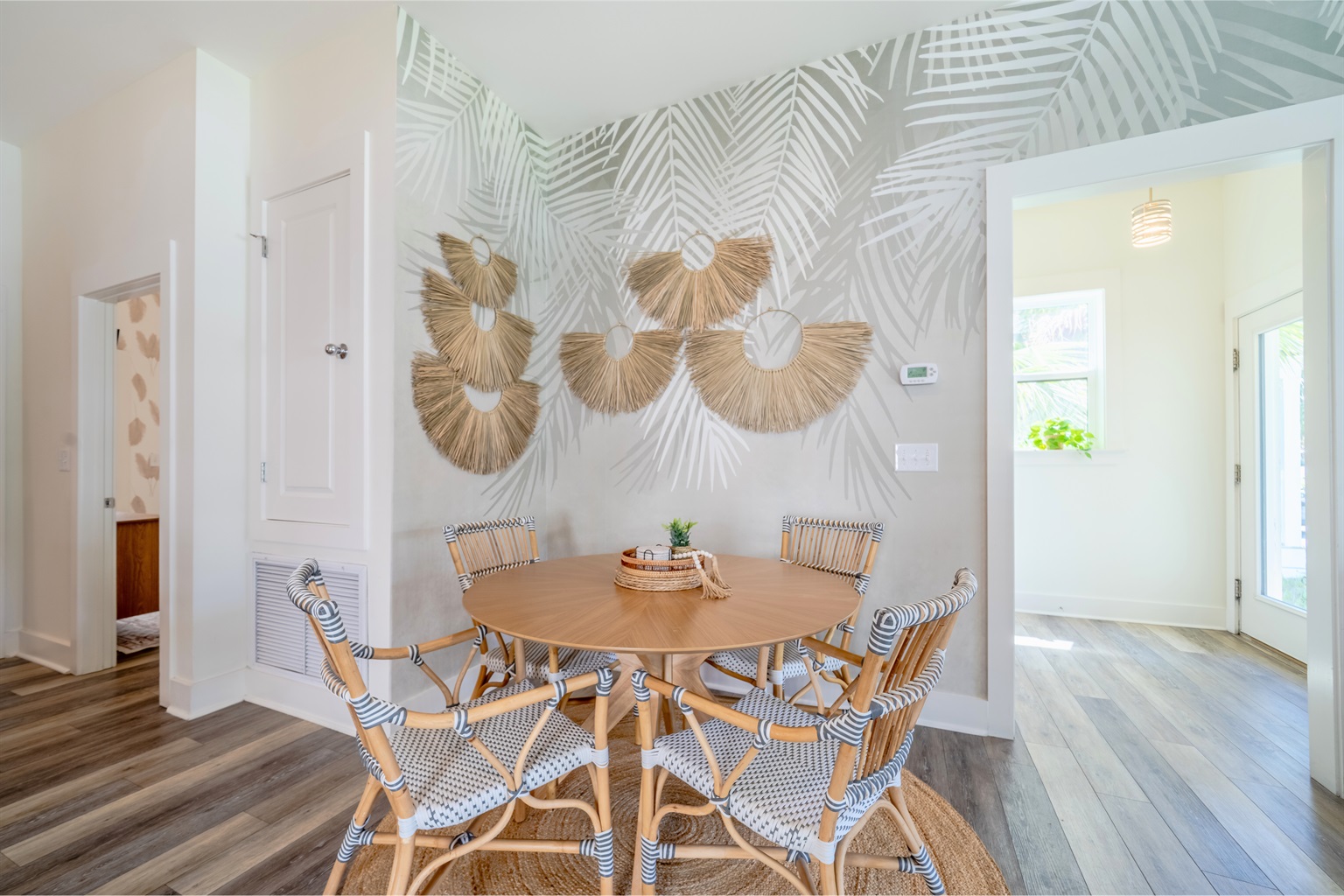 Dining table with a tropical touch—enjoy meals by the stylish palm tree accent wall