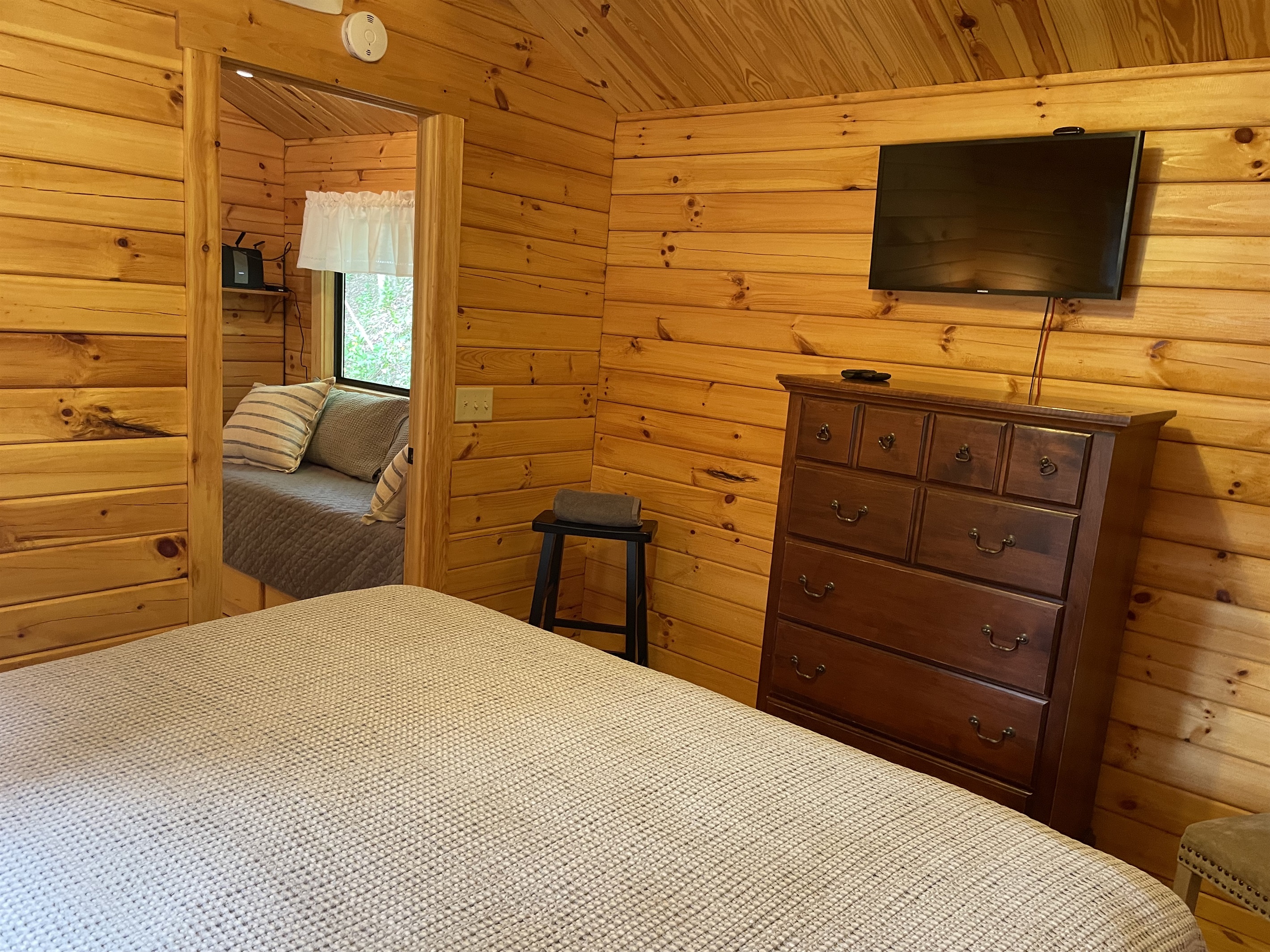 King bedroom with childs bed in hallway