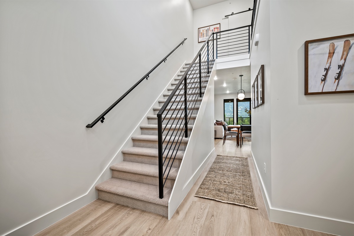 Spacious landing with natural light and mountain views from the window.