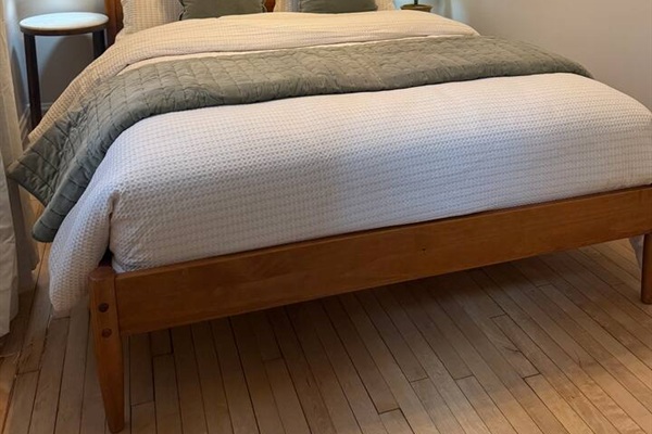 Queen bedroom with primium bedding designed for maximum comfort.