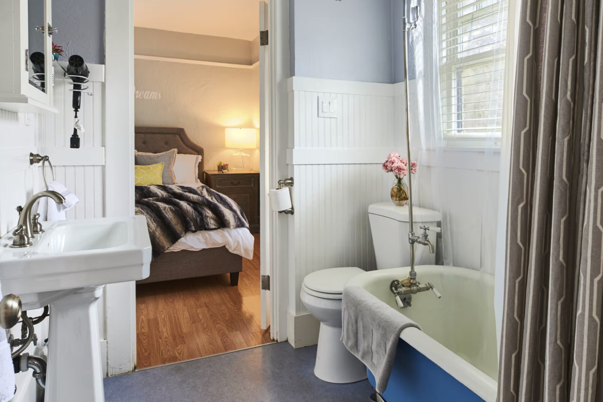 Jack and Jill Ensuite Bath to Bedroom and Livingroom. Deep soaking clawfoot tub.