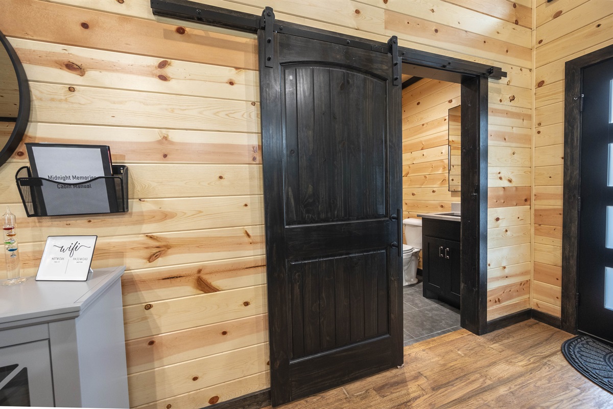 Off the kitchen is a half bath and laundry room with full size washer and dryer.
